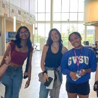 Students in the library for a scavenger hunt during orientation